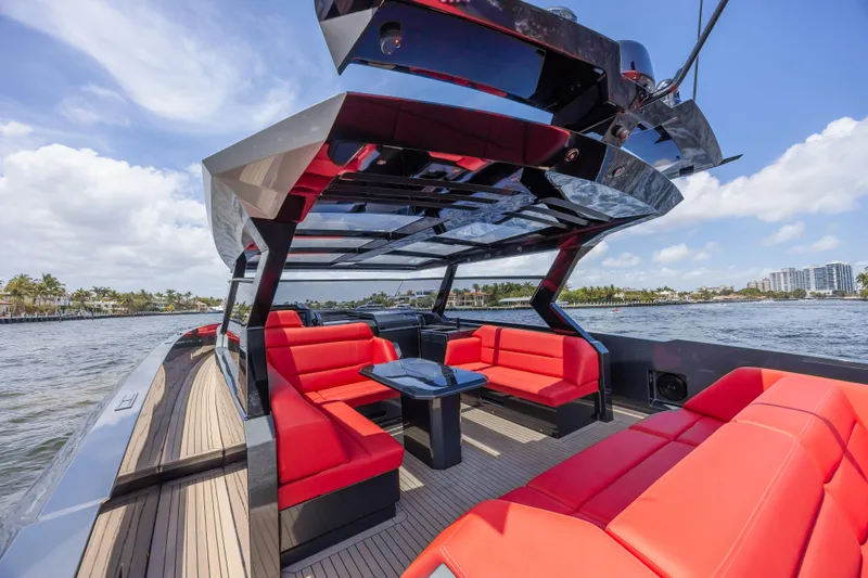 Moonshot Yacht Photos Pics Luxurious 2023 Vanquish Yachts VQ58 with sleek design and vibrant red seating.