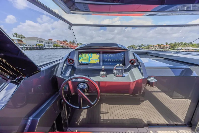 Moonshot Yacht Photos Pics Helm of 2023 Vanquish Yachts VQ58 with modern navigation system and waterfront view.