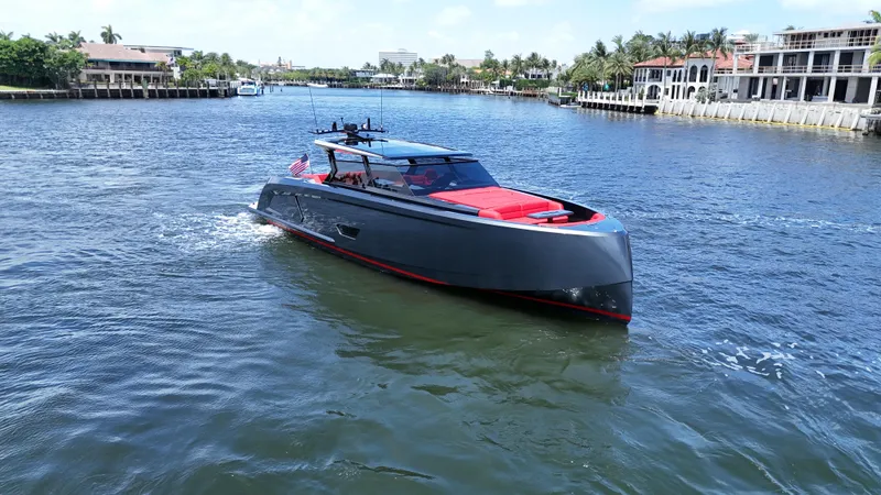 Moonshot Yacht Photos Pics 2023 Vanquish Yachts VQ58 cruising on a sunny day in a scenic waterway.