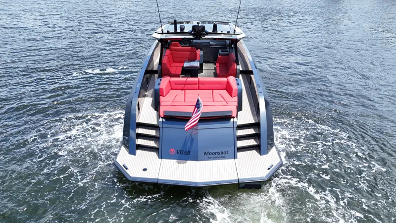 Moonshot Yacht Photos Pics 2023 Vanquish Yachts VQ58 with red seating, cruising on water.