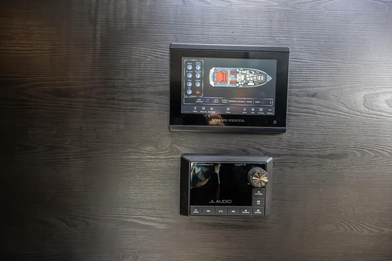 Moonshot Yacht Photos Pics Control panels on 2023 Vanquish Yachts VQ58, featuring navigation and audio systems.