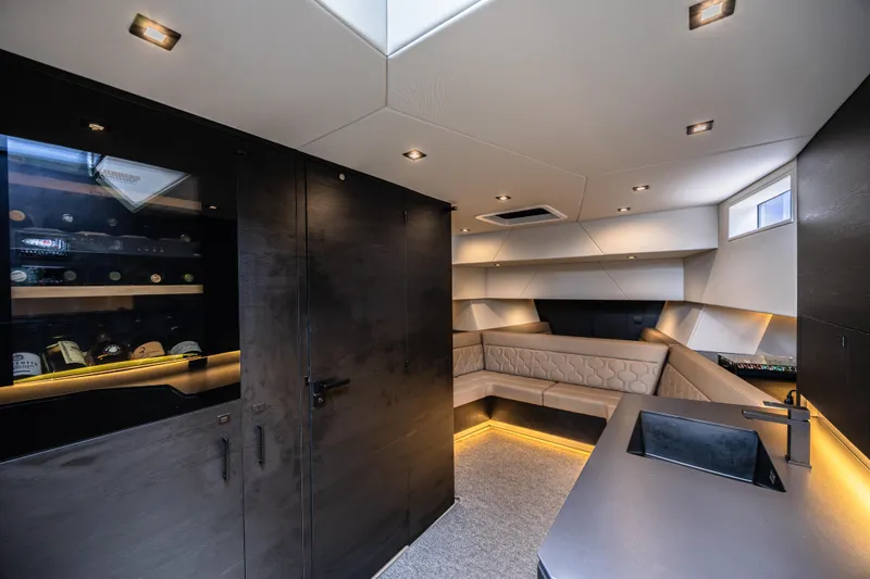 Moonshot Yacht Photos Pics Luxurious interior of 2023 Vanquish Yachts VQ58 with modern design and ambient lighting.