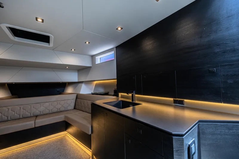 Moonshot Yacht Photos Pics Luxurious interior of 2023 Vanquish Yachts VQ58 with modern lighting and sleek design.