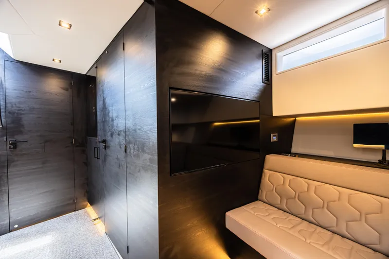 Moonshot Yacht Photos Pics Luxurious interior of 2023 Vanquish Yachts VQ58 with modern seating and sleek design.