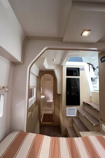  Yacht Photos Pics Interior of 2021 Aquila 36 Sport yacht, featuring modern design and wooden accents.