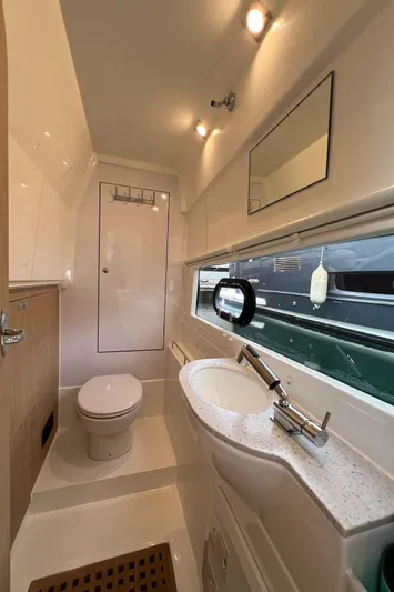  Yacht Photos Pics 2021 Aquila 36 Sport bathroom interior with modern fixtures and lighting.