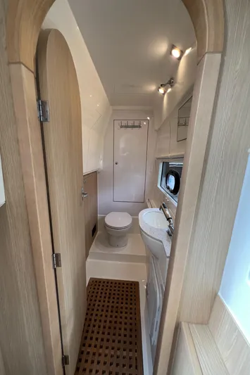  Yacht Photos Pics 2021 Aquila 36 Sport yacht bathroom with modern fixtures and wooden accents.