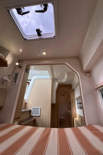  Yacht Photos Pics Interior of 2021 Aquila 36 Sport yacht, featuring a cozy cabin with skylight.