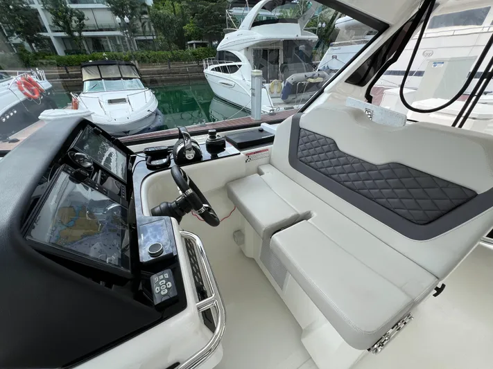  Yacht Photos Pics Interior of 2021 Aquila 36 Sport boat with modern helm and seating.