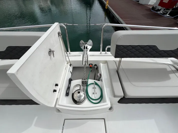  Yacht Photos Pics Aquila 36 Sport 2021 yacht deck with open storage compartment and anchor.