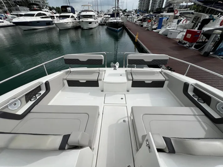  Yacht Photos Pics Aquila 36 Sport 2021 yacht docked at marina, featuring spacious seating and modern design.