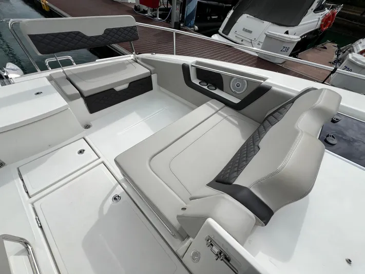  Yacht Photos Pics Luxurious seating on 2021 Aquila 36 Sport boat, featuring modern design and comfortable upholstery.