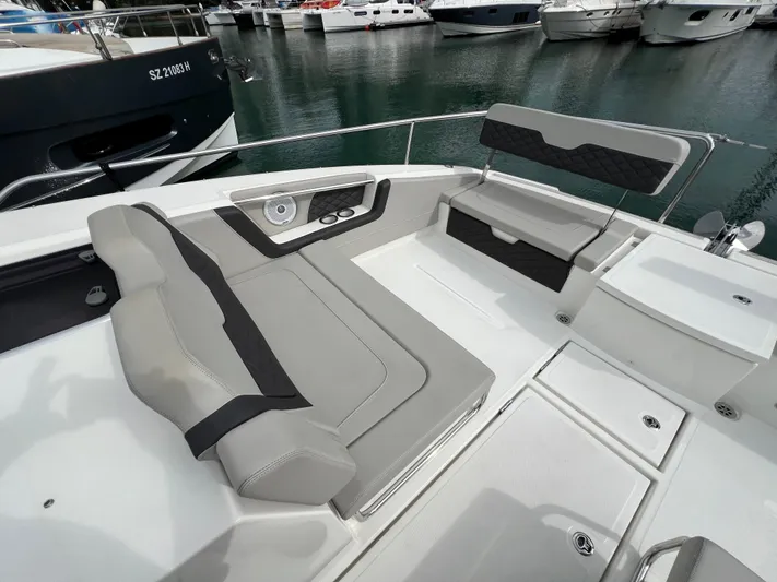  Yacht Photos Pics 2021 Aquila 36 Sport boat with sleek seating and modern design in a marina setting.