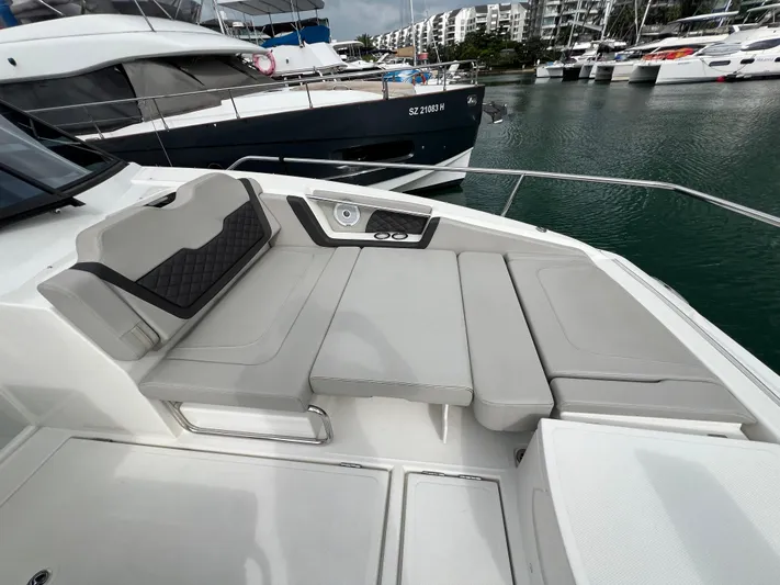  Yacht Photos Pics Aquila 36 Sport 2021 boat with spacious seating at a marina.