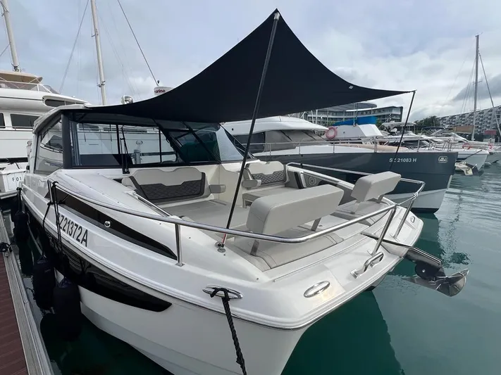 Yacht Photos Pics Aquila 36 Sport 2021 boat docked with sunshade, featuring sleek design and modern amenities.