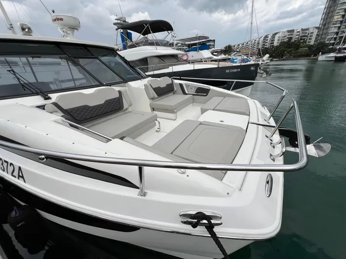  Yacht Photos Pics 2021 Aquila 36 Sport boat with spacious seating, docked in a marina.