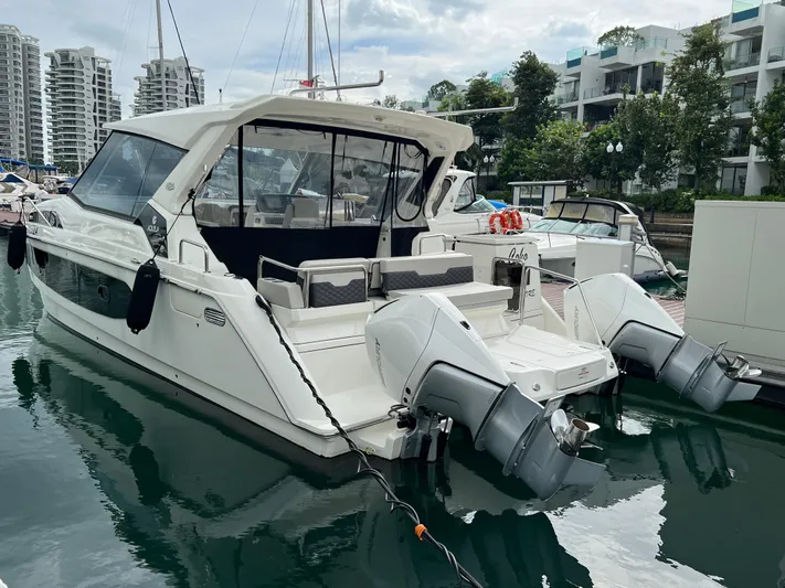  Yacht Photos Pics Aquila 36 Sport 2021 boat docked in a marina with twin outboard engines.