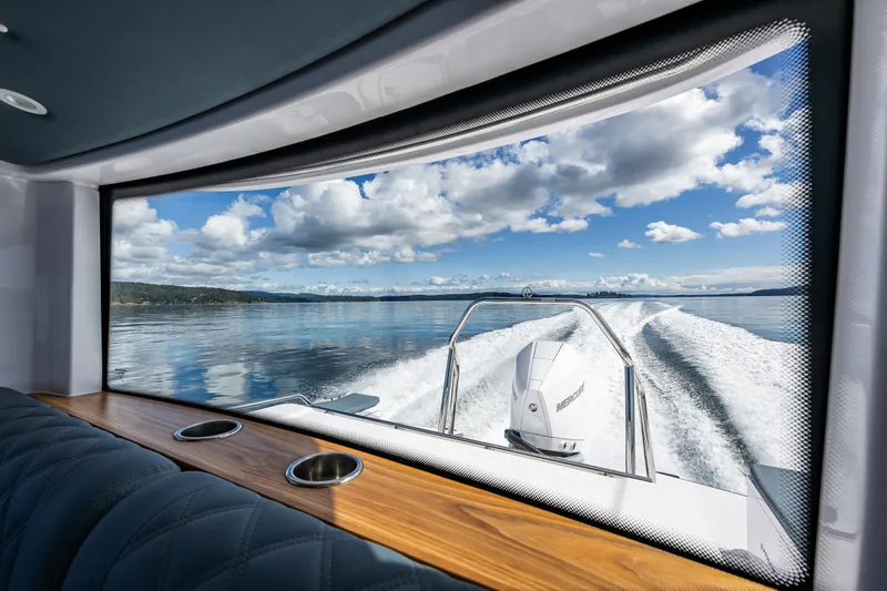 Windermere Yacht Photos Pics View from Axopar 28 boat, 2022 model, showcasing serene waters and blue sky.