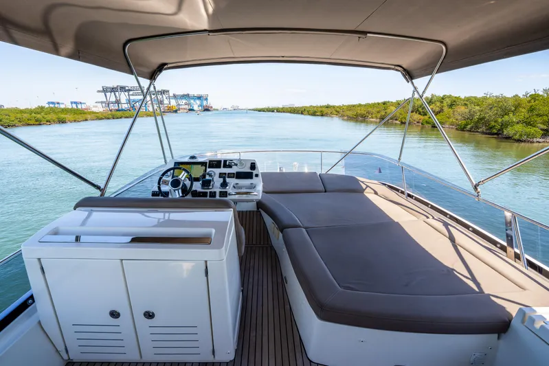  Yacht Photos Pics Flybridge view of 2012 Prestige 500 Fly yacht, featuring spacious seating and navigation controls.
