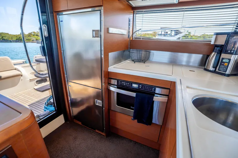  Yacht Photos Pics Modern kitchen interior on 2012 Prestige 500 Fly yacht with stainless steel appliances.