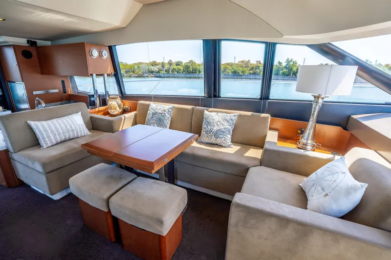  Yacht Photos Pics Luxurious interior of 2012 Prestige 500 Fly yacht with elegant seating and scenic window views.