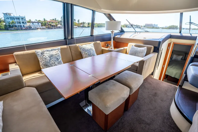  Yacht Photos Pics Luxurious interior of 2012 Prestige 500 Fly yacht with elegant seating and dining area.