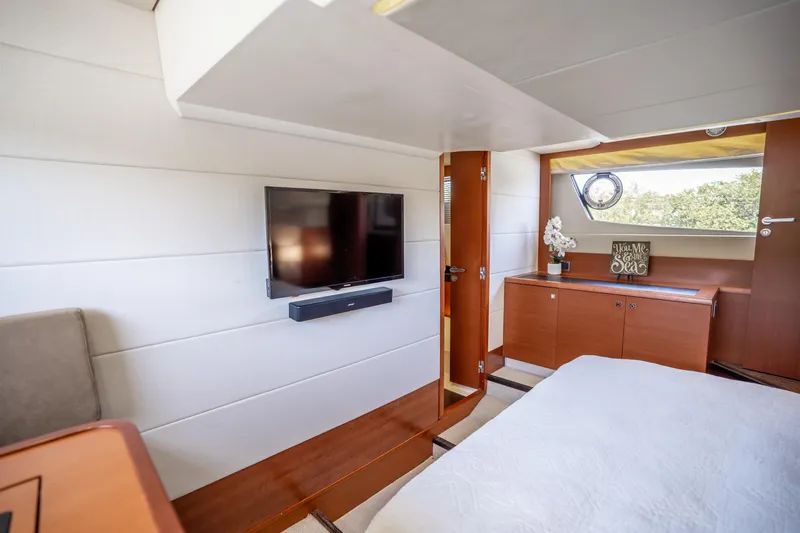  Yacht Photos Pics Luxurious interior of 2012 Prestige 500 Fly yacht with TV and elegant decor.