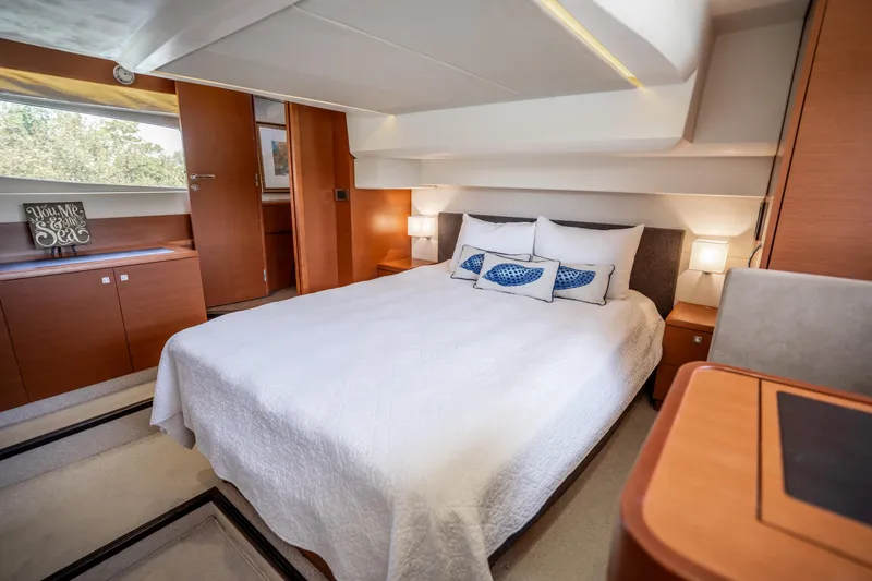  Yacht Photos Pics Luxurious bedroom interior of 2012 Prestige 500 Fly yacht with modern design and cozy ambiance.