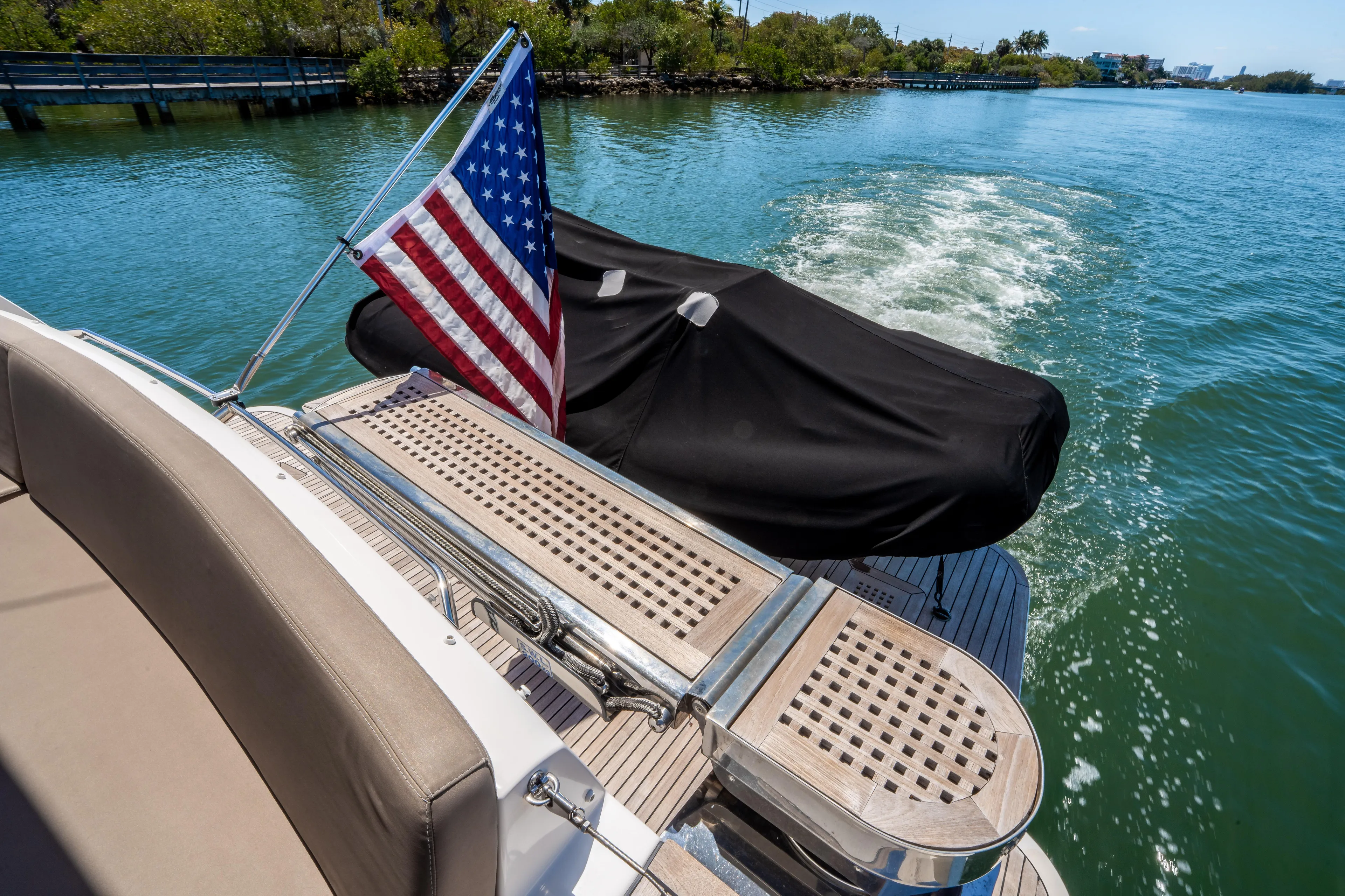  Yacht Photos Pics American flag on 2012 Prestige 500 Fly yacht, cruising on a serene waterway.
