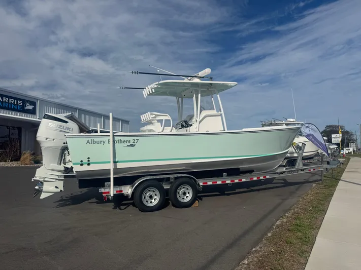  Yacht Photos Pics 2023 Albury Brothers 27 boat on trailer, parked outdoors under a cloudy sky.