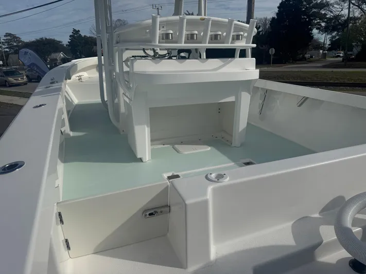  Yacht Photos Pics 2023 Albury Brothers 27 boat interior, showcasing spacious deck and seating area.