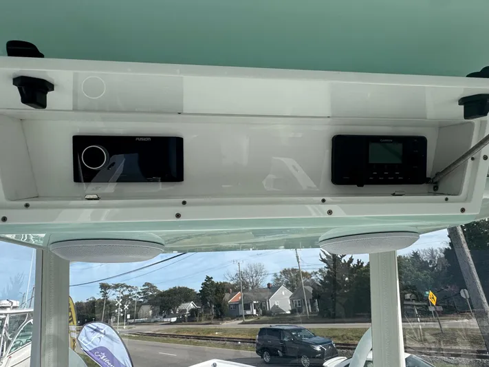  Yacht Photos Pics 2023 Albury Brothers 27 boat dashboard with electronic controls and speakers.