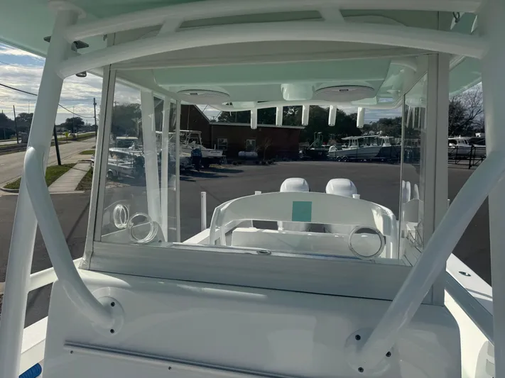  Yacht Photos Pics 2023 Albury Brothers 27 boat, interior view, showcasing helm and seating area.