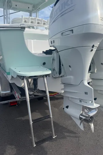  Yacht Photos Pics 2023 Albury Brothers 27 boat with dual outboard engines and a swim ladder.