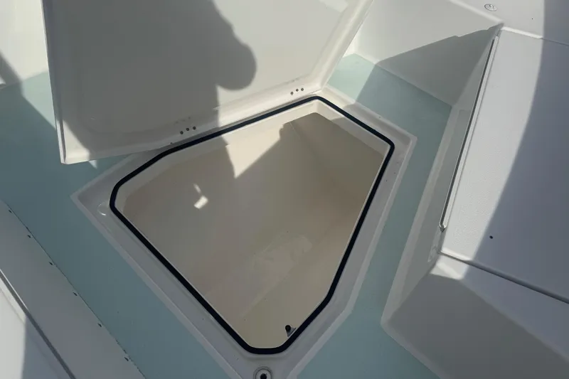  Yacht Photos Pics 2023 Albury Brothers 27 boat storage compartment with open hatch.