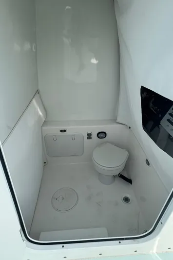  Yacht Photos Pics 2023 Albury Brothers 27 boat interior with compact marine toilet.