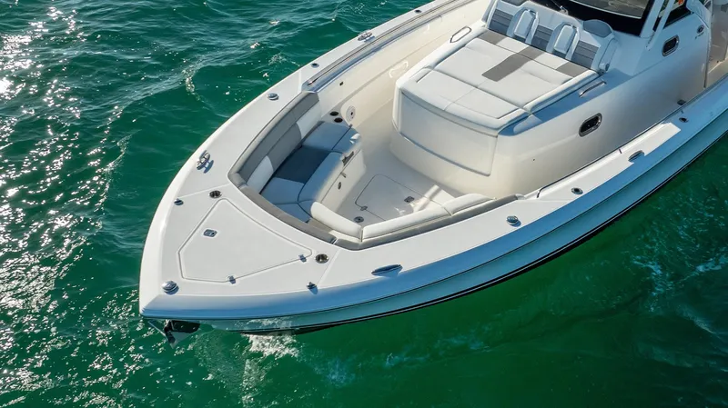  Yacht Photos Pics 2020 Pursuit S 408 Sport boat on clear turquoise water.