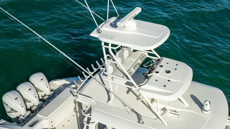  Yacht Photos Pics 2020 Pursuit S 408 Sport boat with multiple engines on blue water.