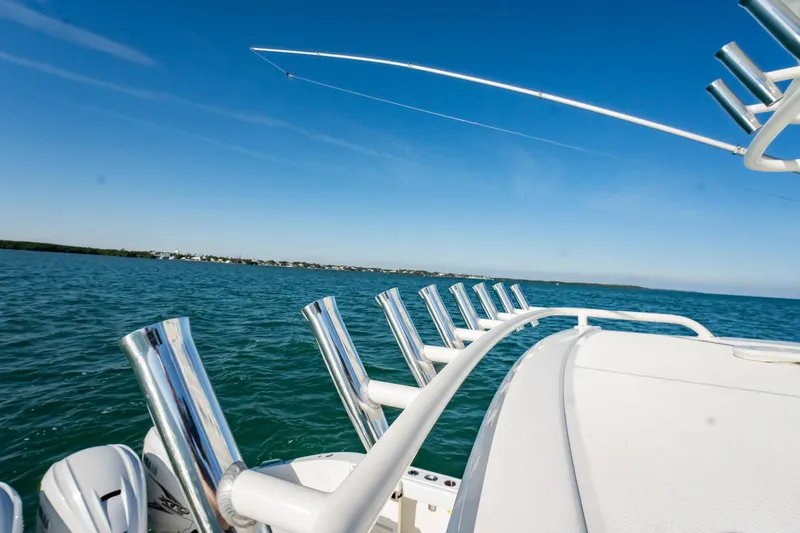  Yacht Photos Pics 2020 Pursuit S 408 Sport boat on open water with fishing rod holders.