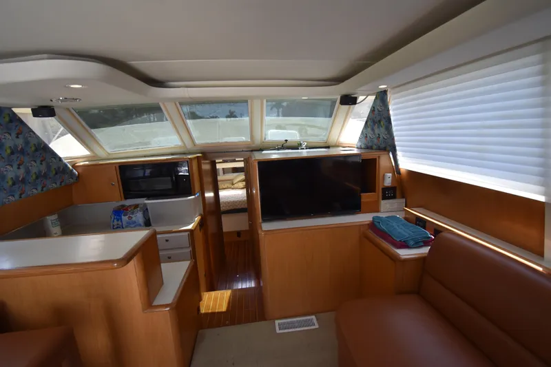  Yacht Photos Pics Interior of a 1997 Tiara 4300 yacht with modern amenities and cozy seating.