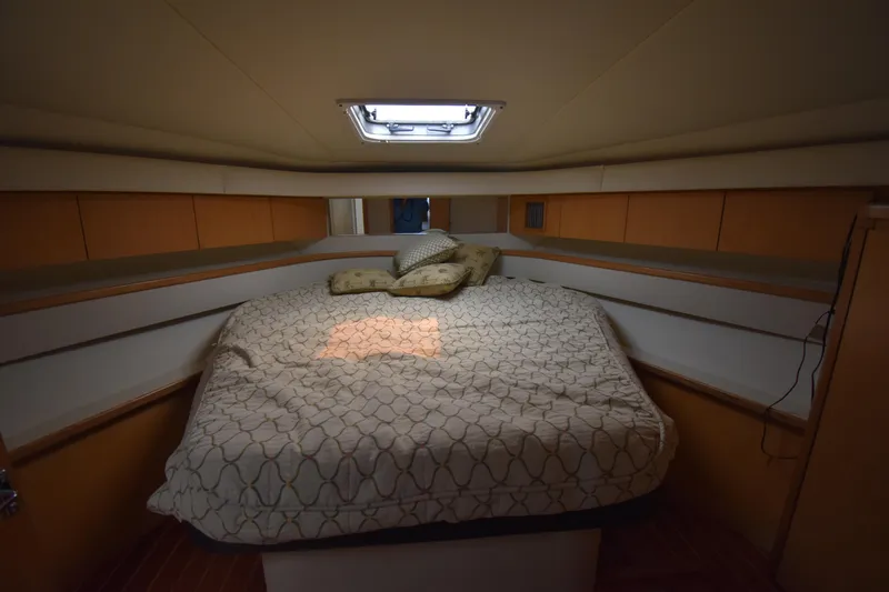  Yacht Photos Pics Mainstate room 1997 Tiara 4300 yacht with a comfortable bed and soft lighting.