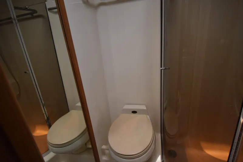  Yacht Photos Pics 1997 Tiara 4300 yacht bathroom with toilet and shower area.