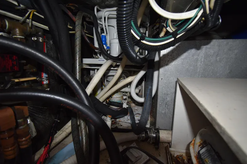  Yacht Photos Pics Engine compartment of a 1997 Tiara 4300, showcasing complex wiring and hoses.