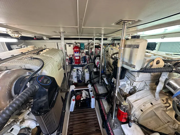 Bella Blue Yacht Photos Pics Engine room of 2004 Grand Banks 49 Eastbay HX, showcasing dual engines and equipment.