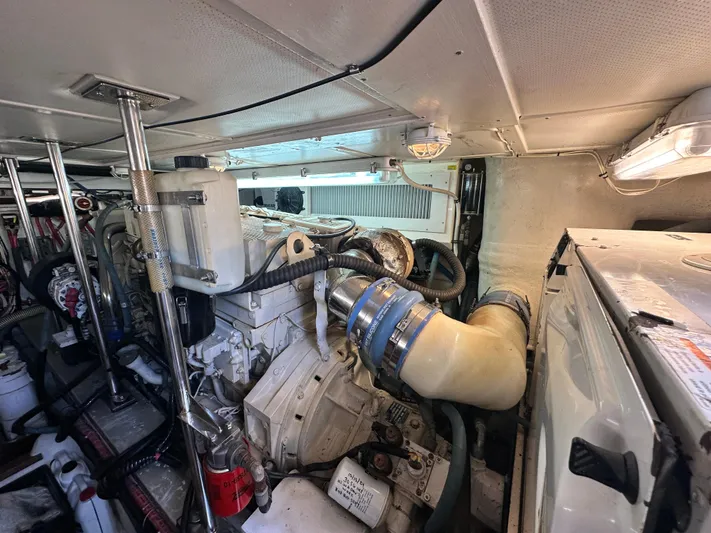 Bella Blue Yacht Photos Pics Engine room of 2004 Grand Banks 49 Eastbay HX, showcasing mechanical components and systems.