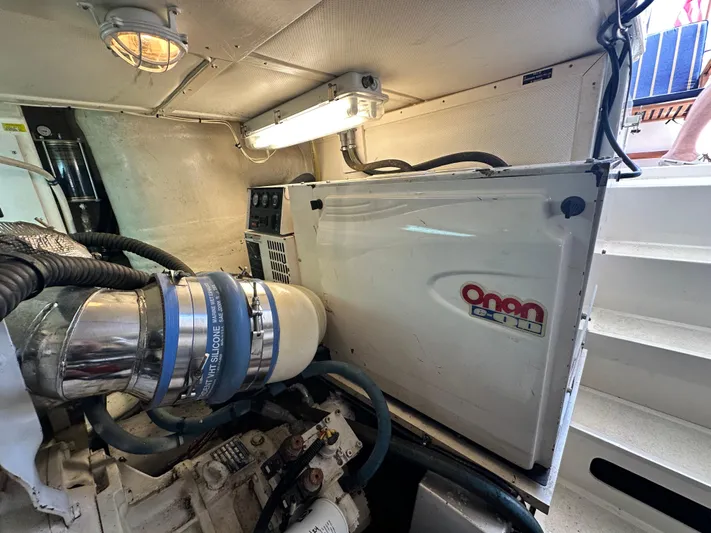 Bella Blue Yacht Photos Pics Engine room of 2004 Grand Banks 49 Eastbay HX with Onan generator.