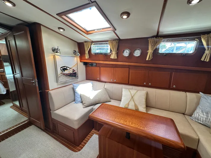 Bella Blue Yacht Photos Pics Luxurious 2004 Grand Banks 49 Eastbay HX yacht interior with elegant wood finishes and cozy seating.