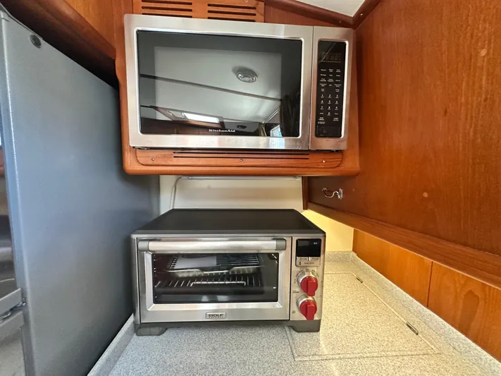 Bella Blue Yacht Photos Pics Microwave and toaster oven in 2004 Grand Banks 49 Eastbay HX yacht kitchen.