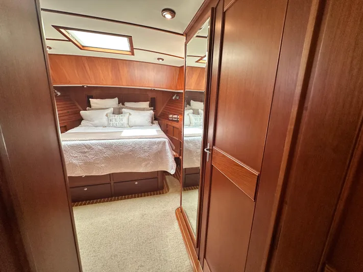 Bella Blue Yacht Photos Pics Luxurious cabin interior of 2004 Grand Banks 49 Eastbay HX yacht with wood finish.