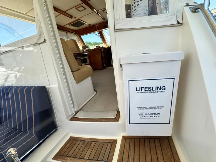 Bella Blue Yacht Photos Pics 2004 Grand Banks 49 Eastbay HX interior with Lifesling overboard rescue system.